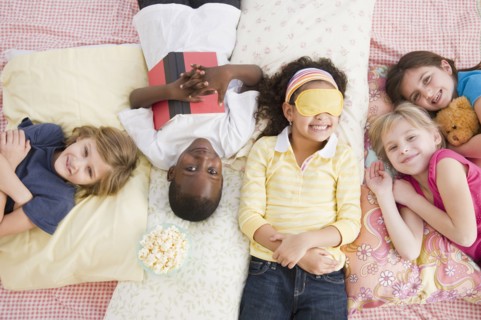 Children having slumber party together