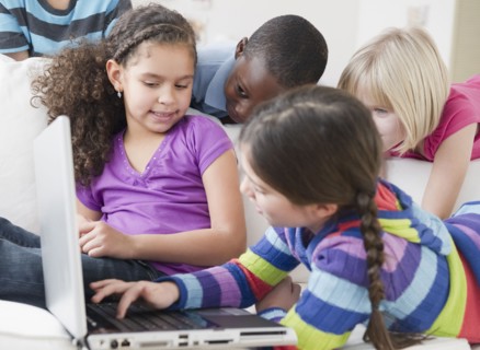 Friends using laptop together