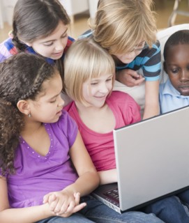 Friends using laptop together