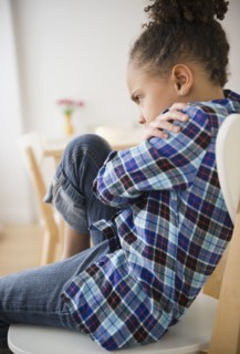 African American girl having temper tantrum