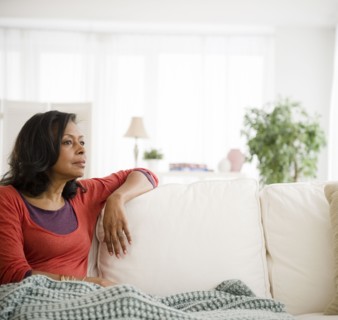 Mixed race woman laying on sofa