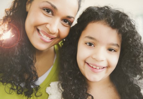 Smiling mother and daughter