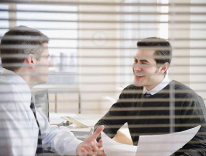 Businessmen working together in office