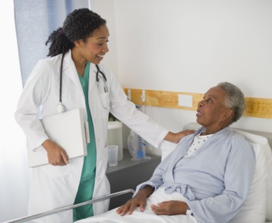 Doctor checking on patient in hospital