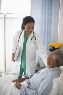 Doctor checking on patient in hospital