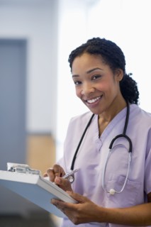 Nurse writing in medical record in hospital