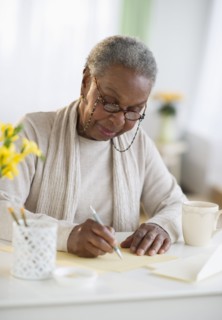 Black woman writing letter