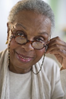 Black woman adjusting eyeglasses