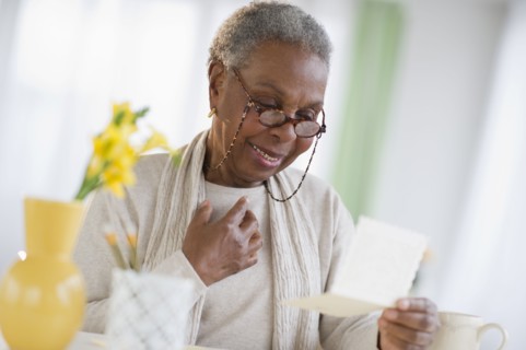 Black woman reading letter
