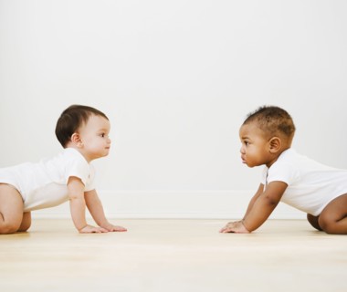 Babies crawling on floor