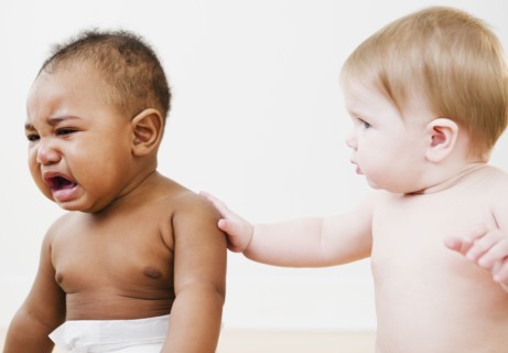 Baby consoling crying friend