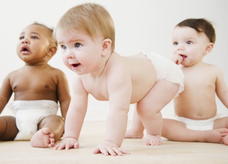 Babies playing together on floor