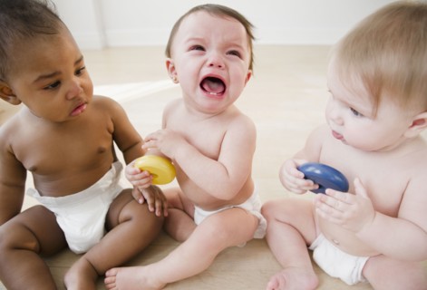 Babies watching crying friend