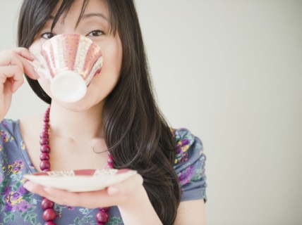 Elegant Korean woman drinking coffee