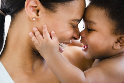 African American mother bonding with baby boy