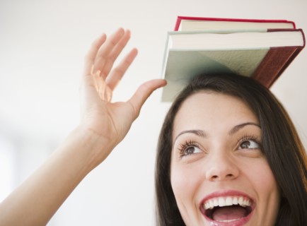 Brazilian woman balancing books on her head