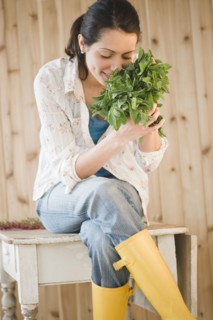 Brazilian woman smelling fresh mint