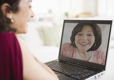 Mother and daughter talking over video chat