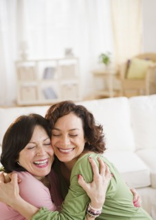 Mother and daughter hugging