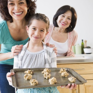 Family baking cookies together