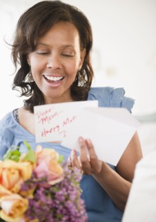 Black woman receiving bouquet of flowers