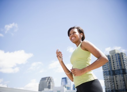 Black woman exercising and listening to mp3 player