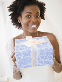 Black bride holding wedding gift