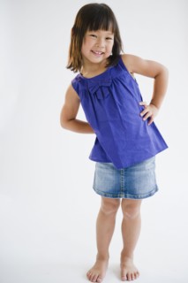 Smiling Korean girl with hands on hips