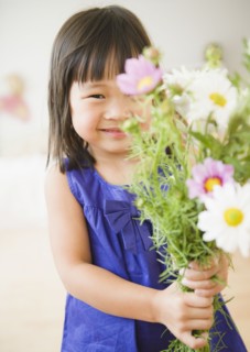 Korean girl holding bouquet of flowers