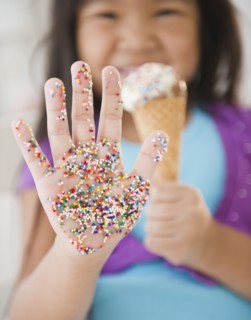 Korean girl with sprinkles on her hand