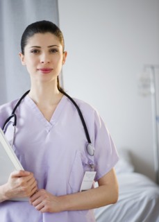 Mixed race nurse standing in hospital