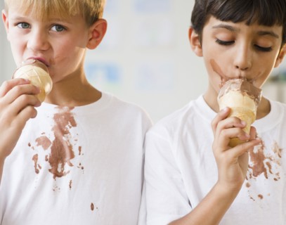 Boys eating dripping ice cream cones