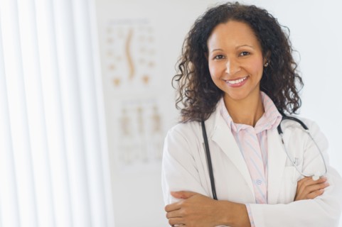 Hispanic doctor standing in hospital