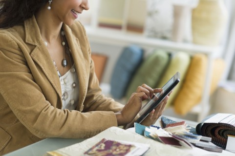 Hispanic businesswoman using digital tablet