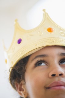 Mixed race girl wearing crown