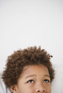 Black boy looking up