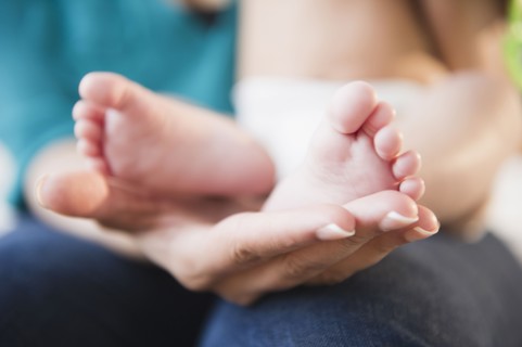 Close up of mixed race baby's feet