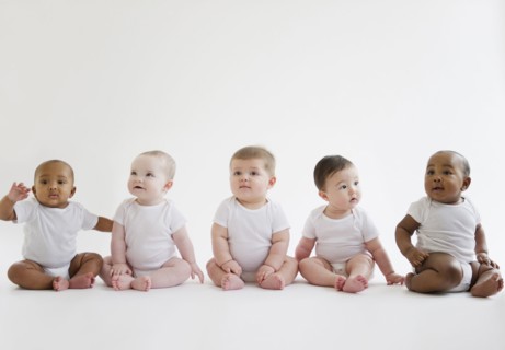 Babies sitting on floor together