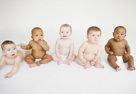 Babies sitting together on floor