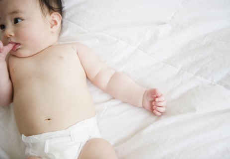 Asian baby girl laying on blanket