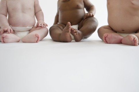 Babies sitting on floor together