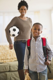 Black mother and son getting ready for the day