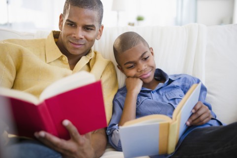 Father and son reading books