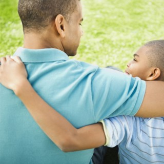 Father and son hugging