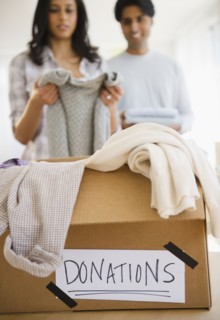 Mixed race couple donating clothing