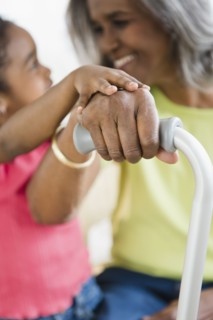 African American girl holding hands with grandmother