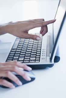 Cape Verdean woman using laptop