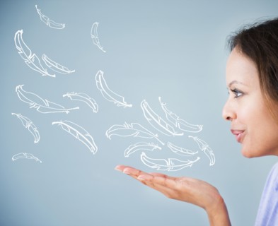 Cape Verdean woman blowing illustrations of feathers