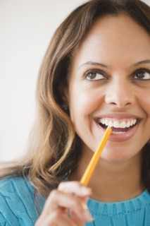 Cape Verdean woman biting pencil