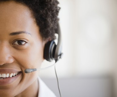 African American woman talking into headset
